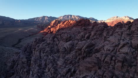 aerial-red-rock-formation-in-Las-Vegas-california-tourist-main-attraction-drone-reveal-rock-patterns