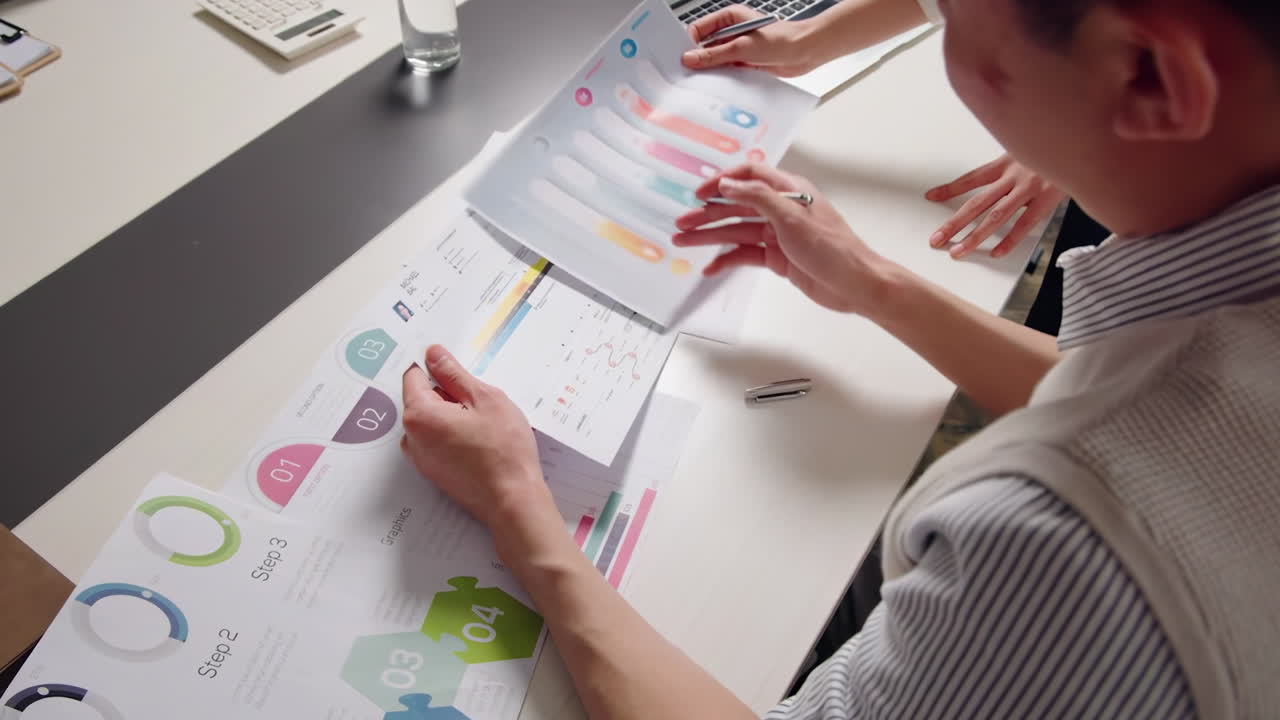 Teammate professional working on Business Statistics, Marketing Plans in Corporate Office. Closeup View Discussion and Financial Data Analysis on Laptops Charts. Teamwork And Innovation.