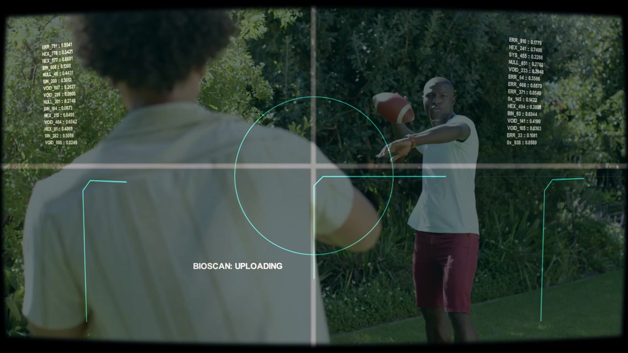 Raising hands, right man white T catching, passing football playing in yard BIOSCAN: UPLOADING
