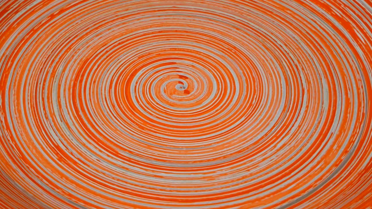 Spiral abstract red or brown background, clay dish.