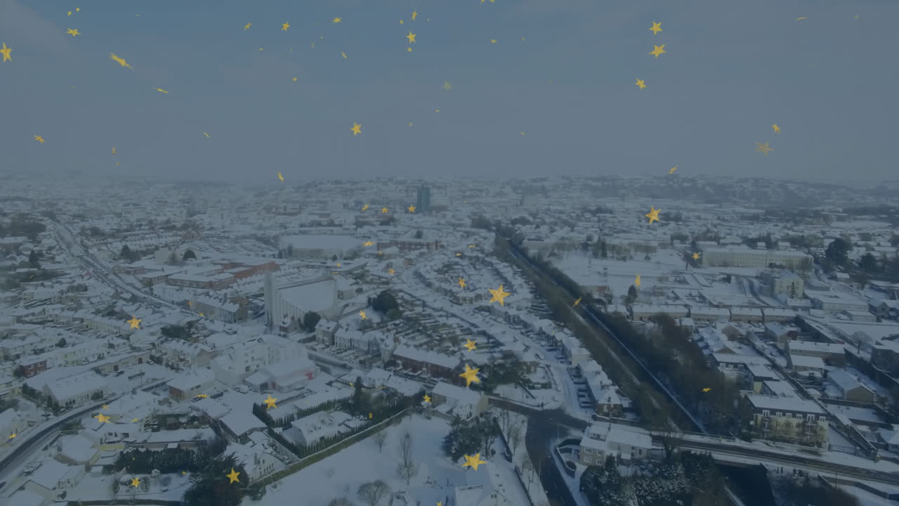 Animated yellow stars scattered in snow-covered cityscape sky at night
