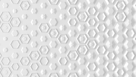 seamless loop a white wall of many different hexagons manifests gradually from a flat white wall.3d render.