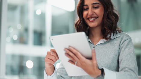 woman using a tablet in an office environment