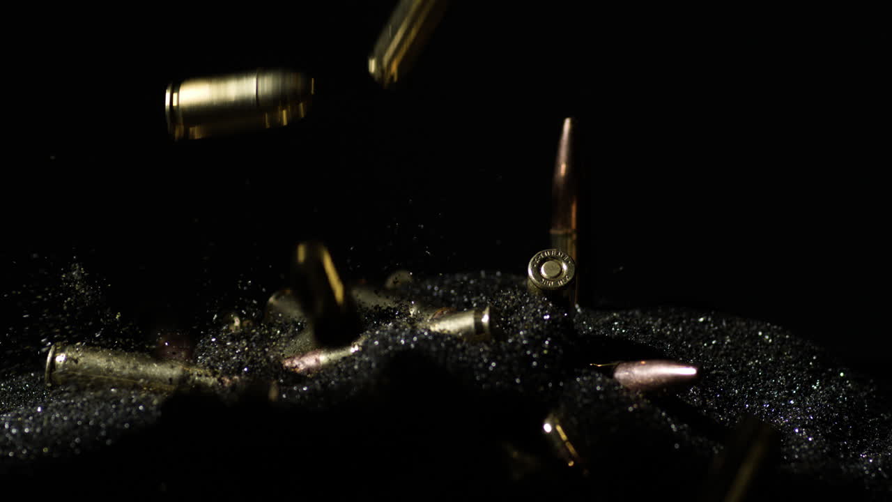 Variety Of Gun Bullets Dropping Over Smokeless Powder