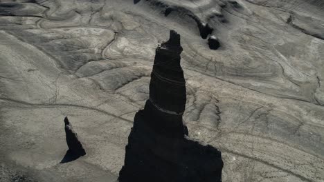 Aerial-View-of-Long-Dong-Silver,-Spire-Rock-Formations-in-Gray-Desert-Landscape-of-Utah-USA