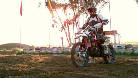 man riding a motor cross bike