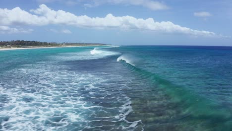 Aerial-View-of-Coral-Reefs-and-Ocean-Waves-in-Front-of-White-Sand-Beach-and-Coastline-of-Tonga,-Polynesia