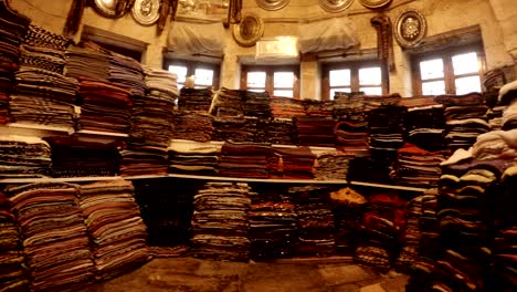 interior of ethnic shop with different kind fabric of  in courtyard of balikligol pool of sacred fish