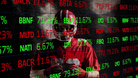 animación de datos del mercado de valores moviéndose sobre jugador de rugby afroamericano sosteniendo la pelota sobre el espacio
