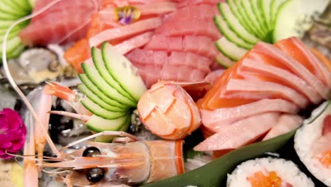 assorted sushi and sashimi delicacies on display