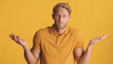 bearded blond man saying no and raising his arms