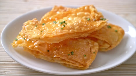 crispy roti with sugar on plate