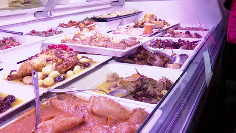 variety of prepared foods in a refrigerated display case