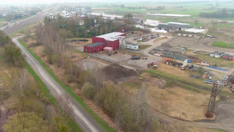 Industrial-factory-facility-in-rural-area-of-Lithuania,-aerial-view