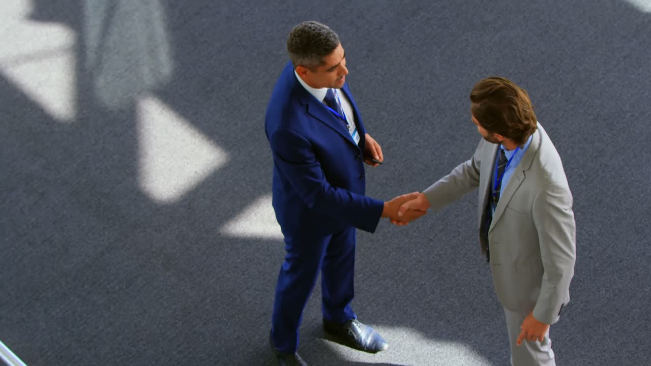 Caucasian businessmen shaking hands in the office 4k