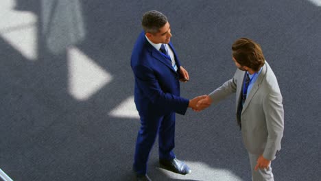 caucasian businessmen shaking hands in the office 4k