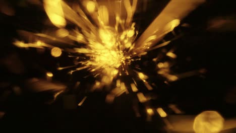 explosion gold lights sparkles. glowing light explodes. flare in center.