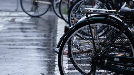 close up bikes in parking in japan on a rainy day