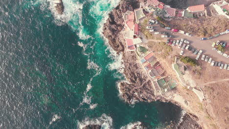 Overhead-view-of-waves-splash-on-rocks