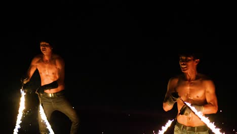 fire jugglers performance at night