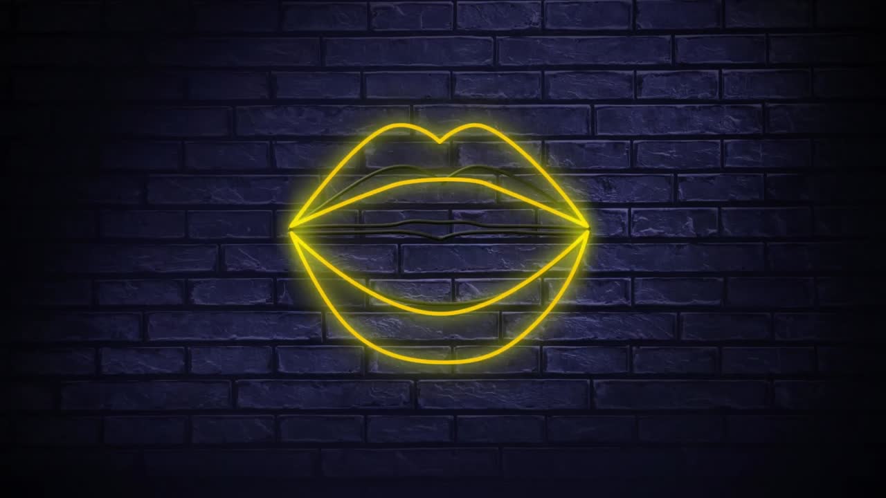 un cartel de neón que muestra los labios soplando besos