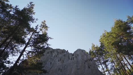 Tilting-drone-shot-revealing-the-beehive-like-niches-of-Eagle's-Rock-also-known-as-Orlovi-Skali-situated-on-Rhodope-Mountain-in-Bulgaria