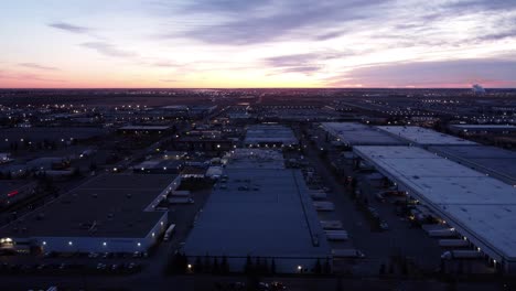 drone footage captures the cityscape at night just before sunrise in canada