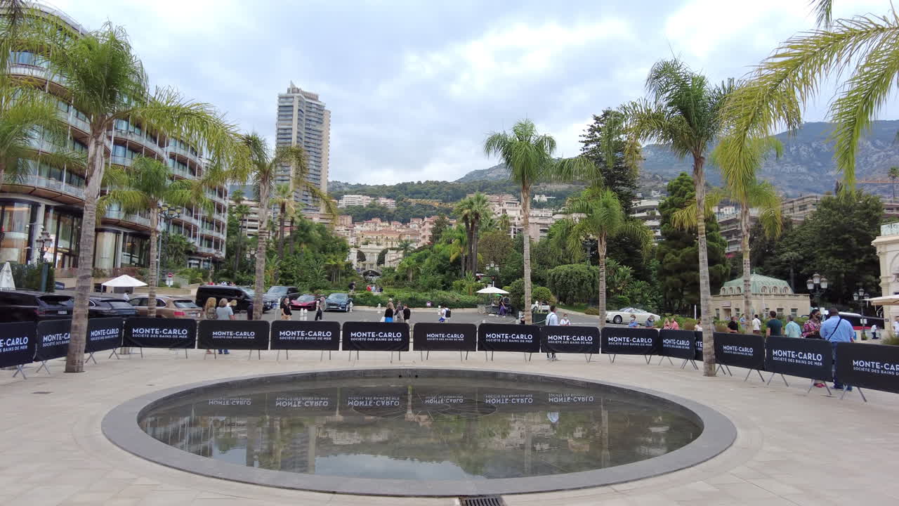Monte Carlo, Monaco - December 23, 2021: Water fountain in front of the Hotel de Paris Monte-Carlo in Monaco