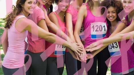 animation of multiple pink ribbon logo over diverse group of smiling women