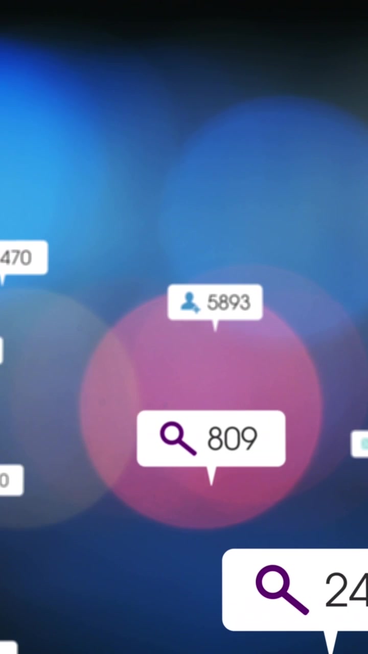 Animation of social media icons against colorful spots of light against dark background
