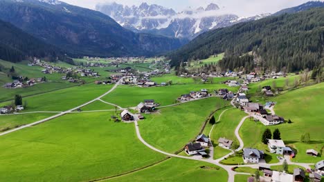 drone-shot-with-houses-and-river-Austria,Gosau