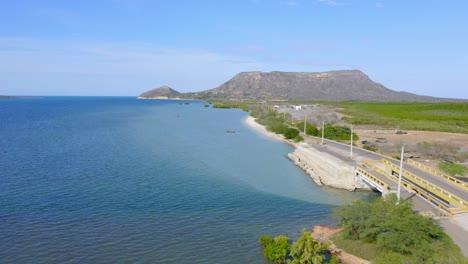 Aerial-View-Of-Playa-Bolanos-And-El-Morro-Mountain-In-Monte-Cristi,-Dominican-Republic---drone-shot