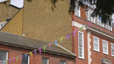 bunting hangs over village street party