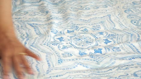 blue and white patterned bedding