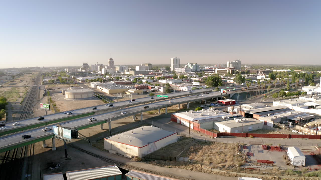 Aerial view of a city with an elevated highway and urban landscape