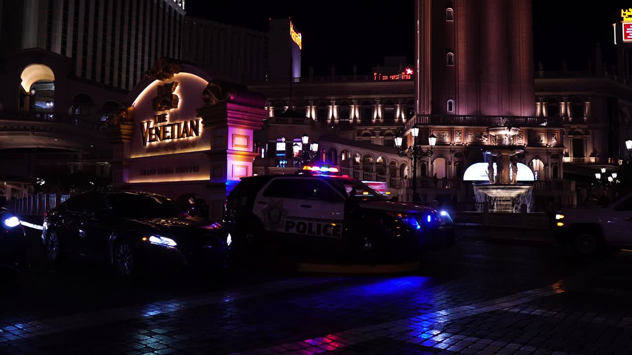 The Venetian Hotel and Police Car at Night