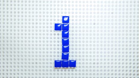 stop motion of the number 1 creating one pixel at the time, made with children toys