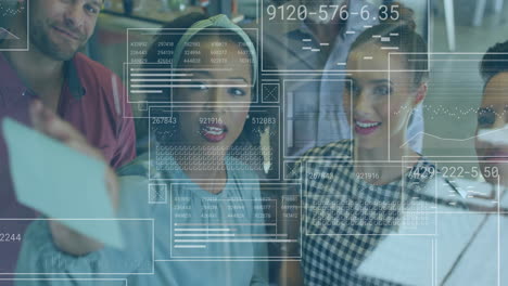 collaborating with digital data, diverse group working on animation overlay in school