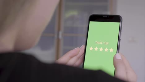 woman rating a business with five stars