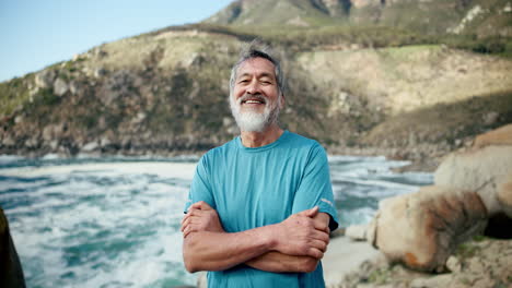 portrait of a smiling older man by the ocean