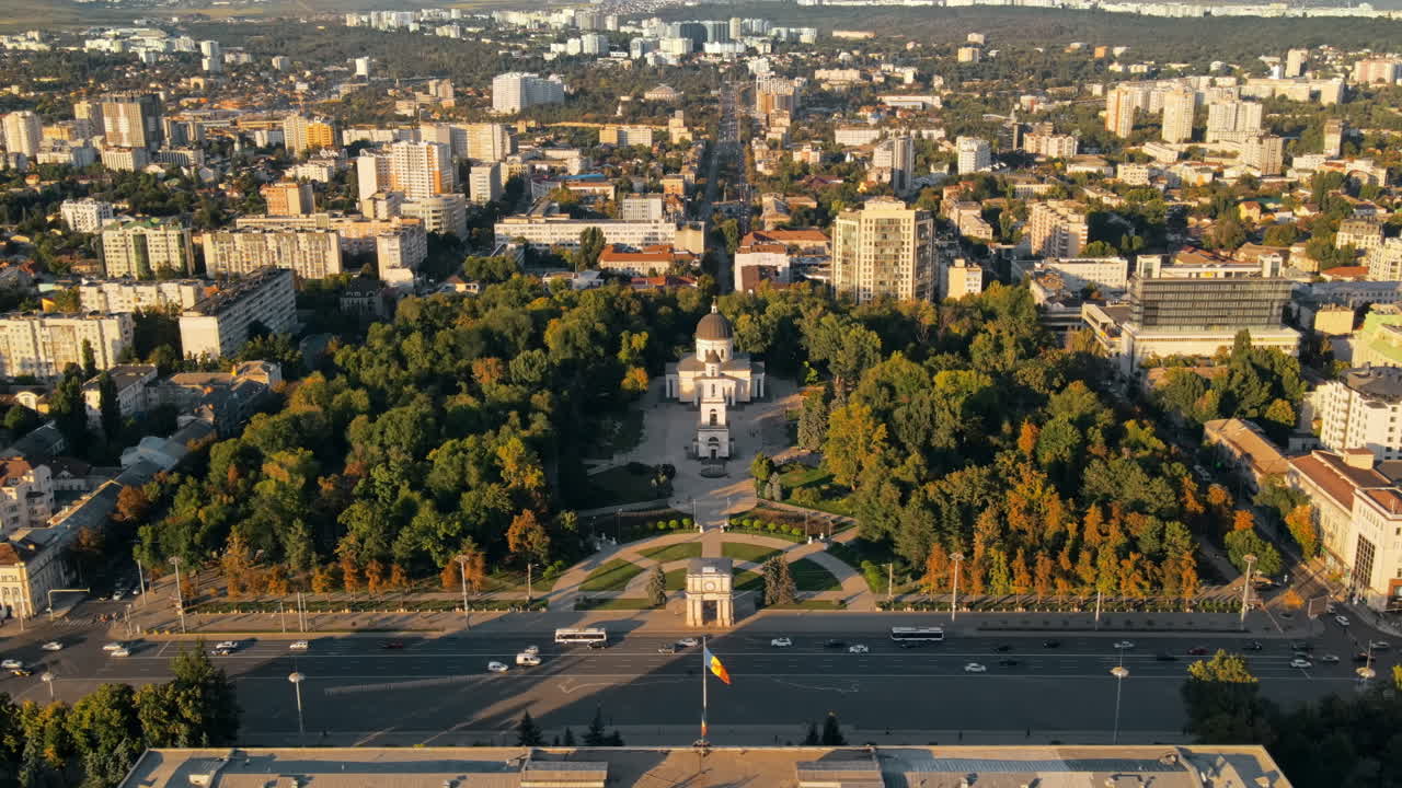 Aerial drone view of Chisinau downtown at sunset. Panorama view of Central Park, Cathedral, Goverment a lot of greenery, buildings. Moldova