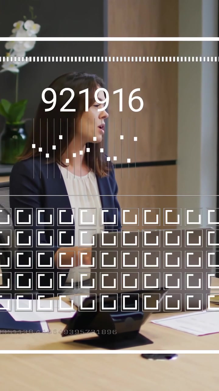 Vertical video: Woman touching laptop and presenting causing animated business numbers cycling