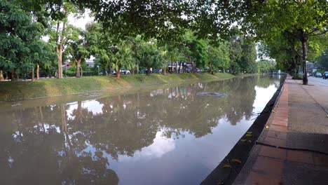 peaceful canal scene in chiang mai, thailand