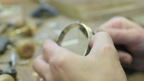 close ups of a craftsman making jewellery in a workshop