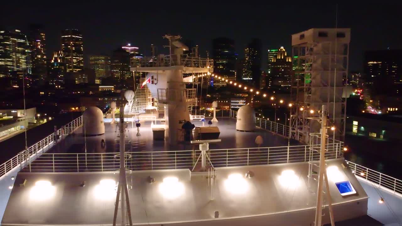 Luxurious deck of Seven Seas Grandeur cruise ship at night. Aerial