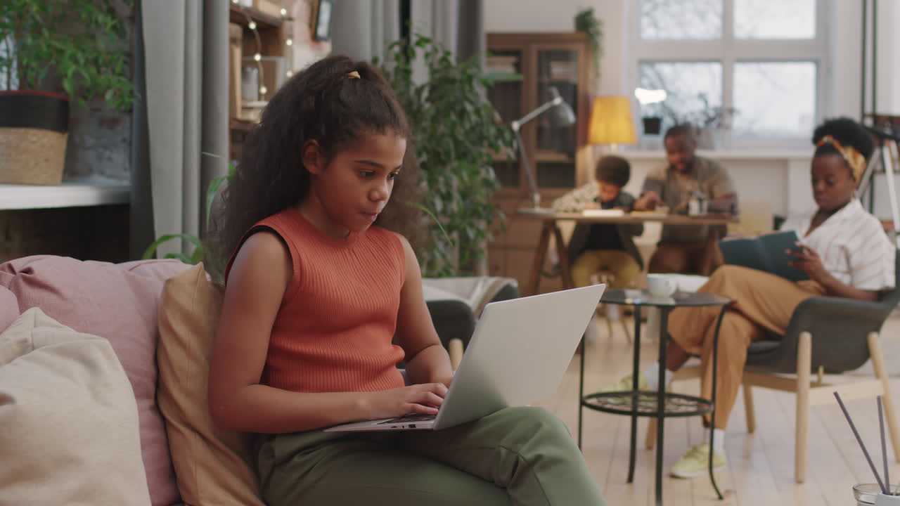 10-Year-Old Afro Girl Studying On Laptop From Home