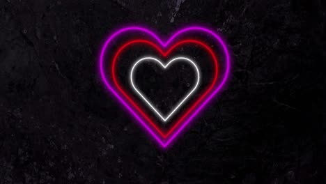 animation of pink red and white concentric neon hearts flashing on black background