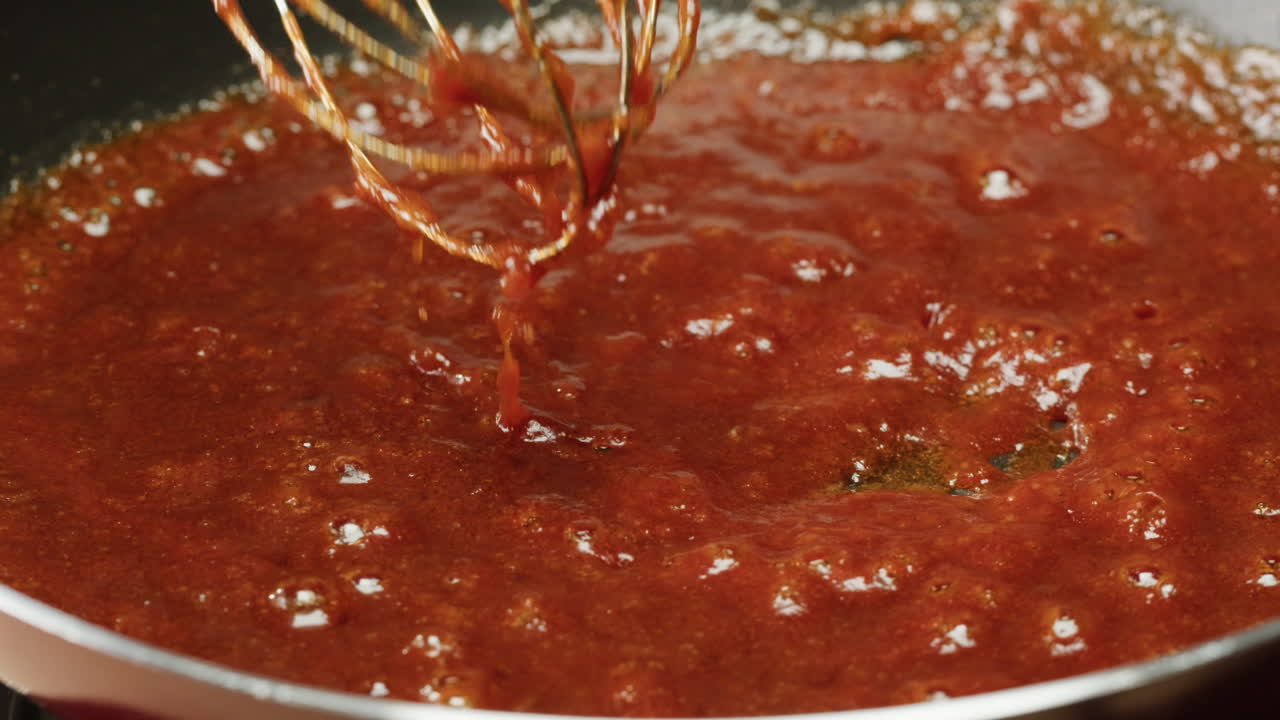 Preparing a red sauce in a pan