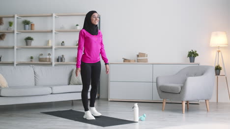 woman doing a balance exercise at home