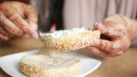 cheese cream spread on fresh bagel bread